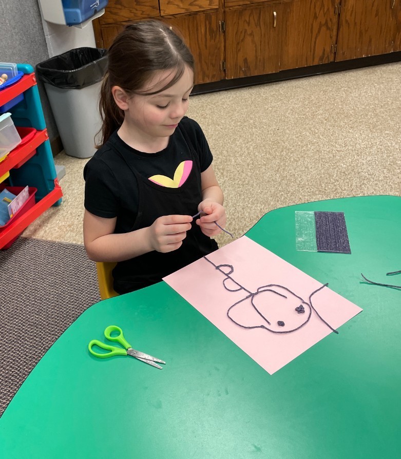 a girl making a picture