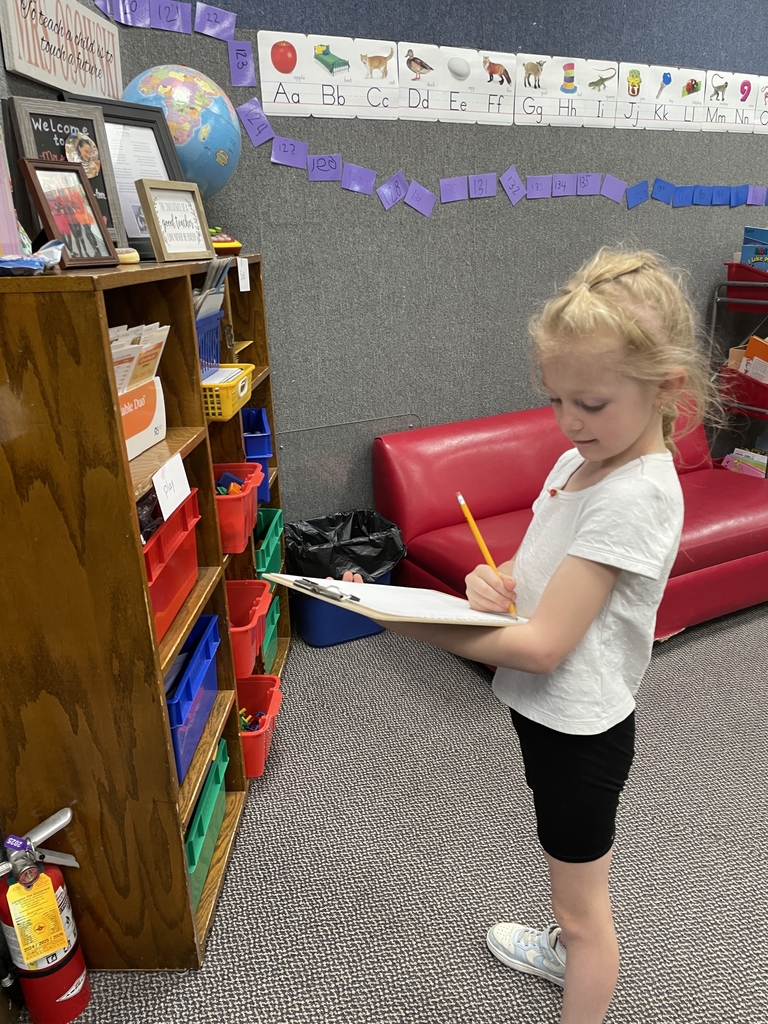 a girl writing down her word.