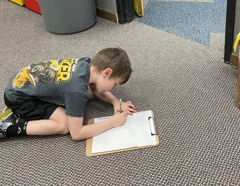 a boy writing words