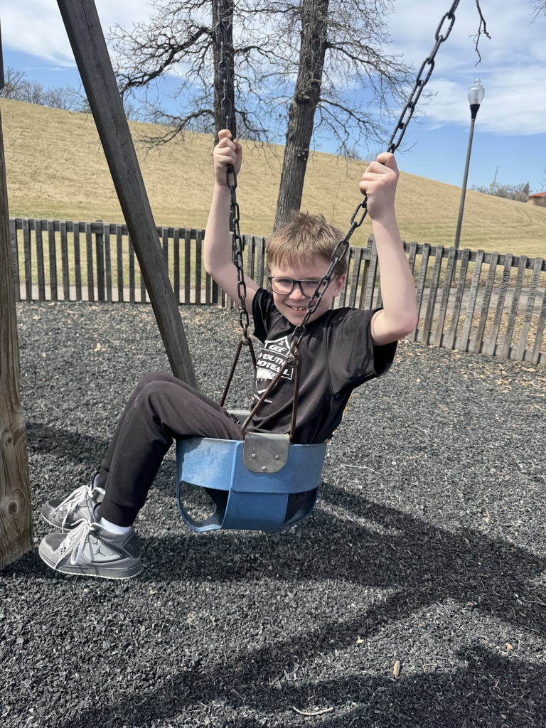 a boy swinging