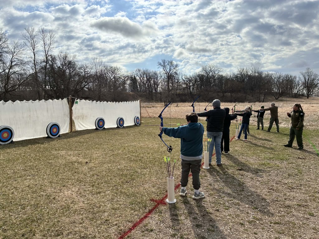 kids shooting arrows