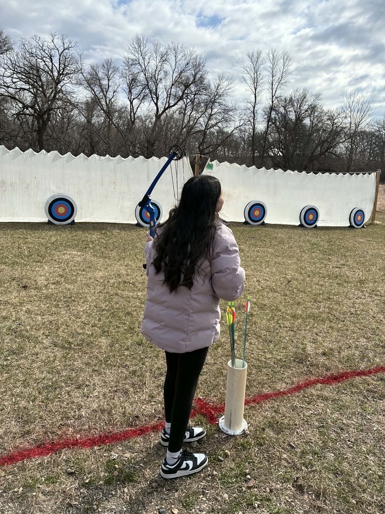 a girl getting ready to shoot