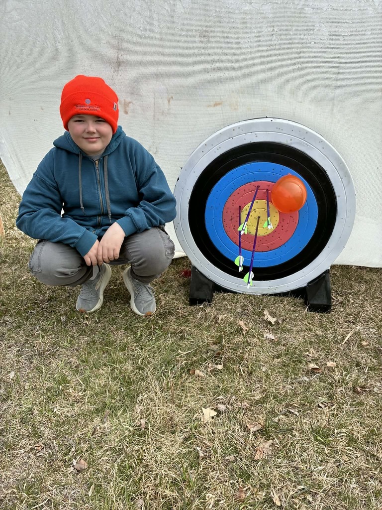 a boy and his arrows