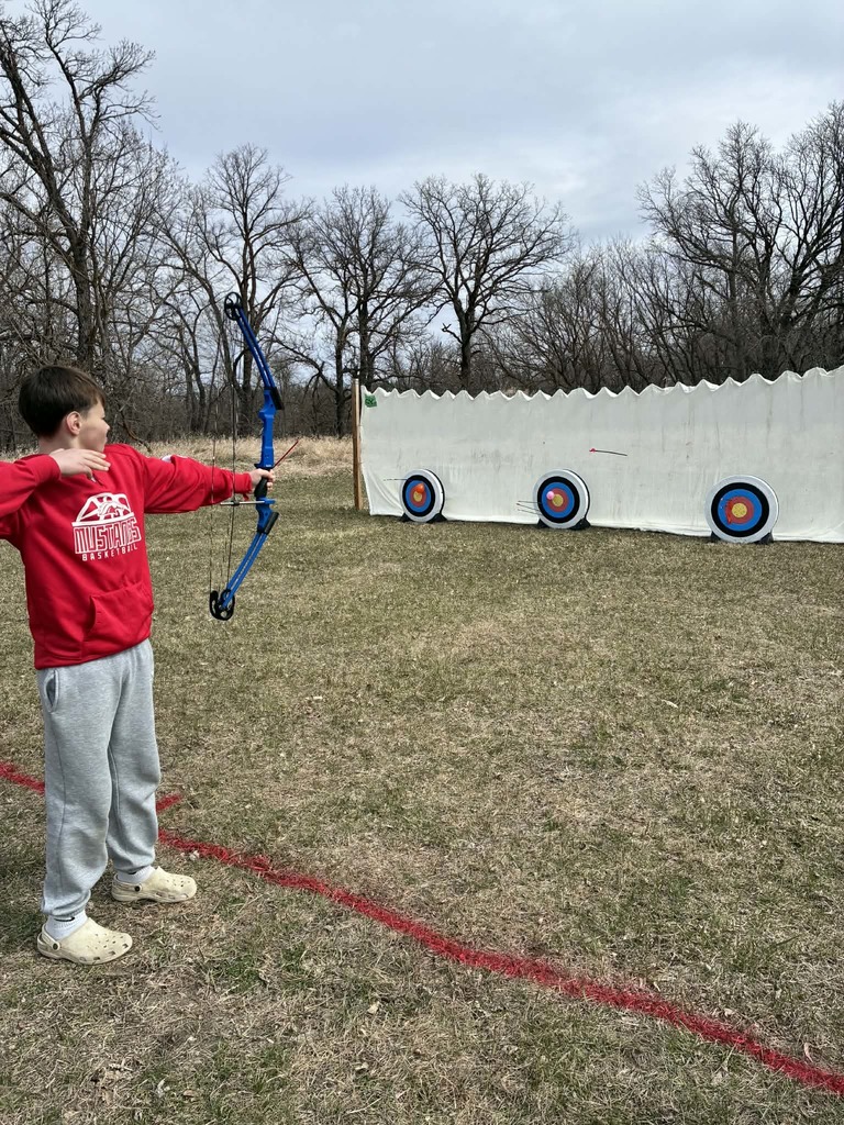 a boy shooting an arrow