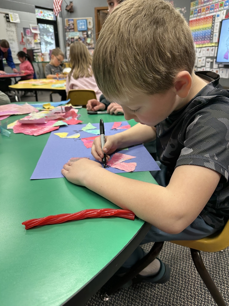 a boy creating some ary