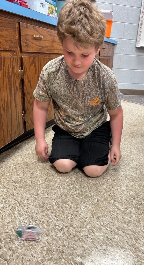 a boy playing with a toy