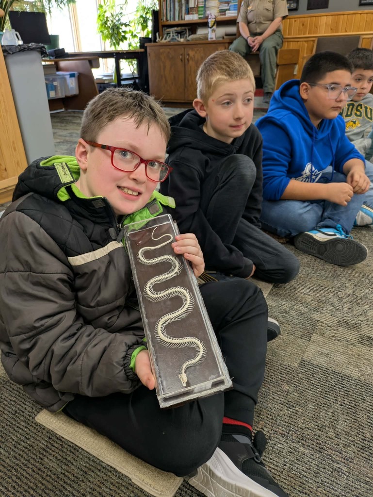 a boy with a snake skin