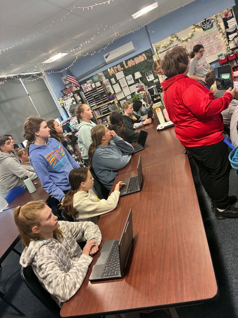 5th graders learning about