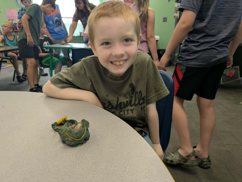 a boy with his stone fish