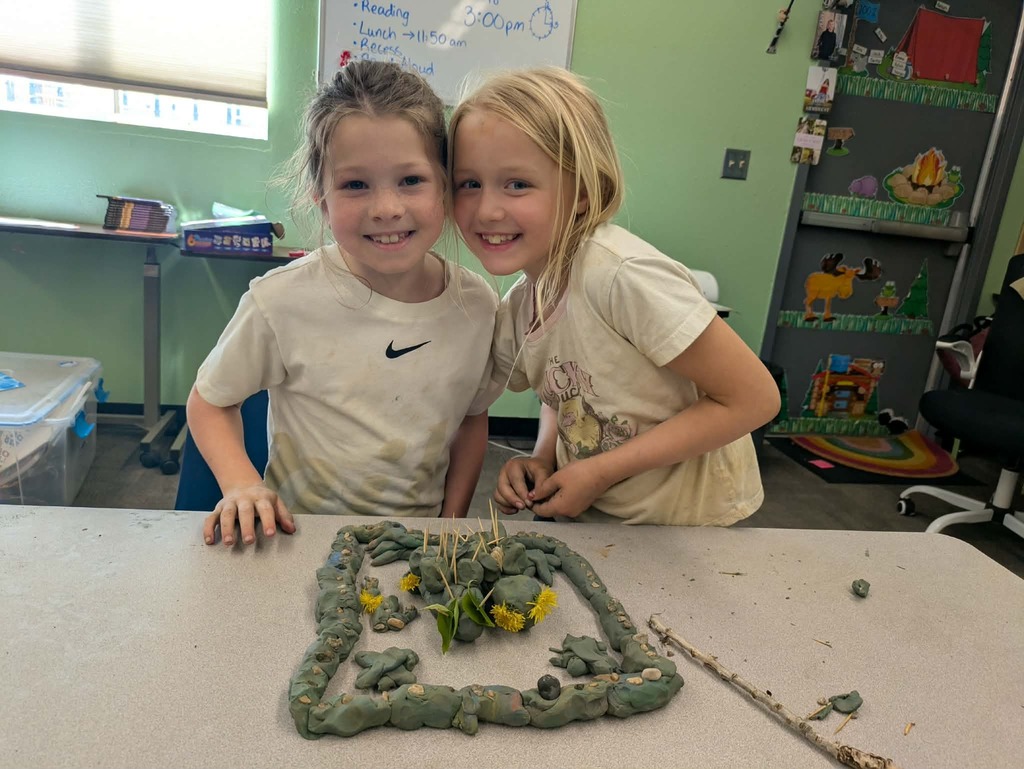 2 girls with their stone fish