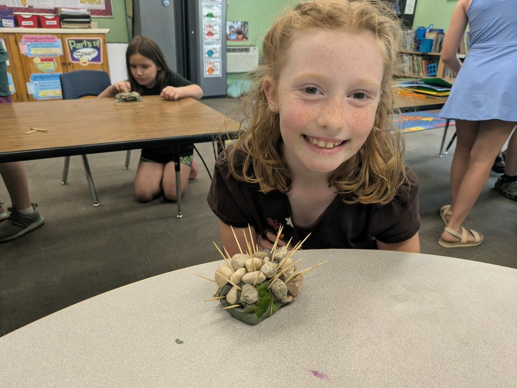 a girl with her stone fish