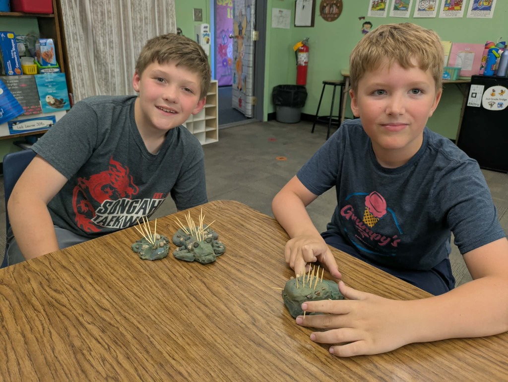 2 boys with their stone