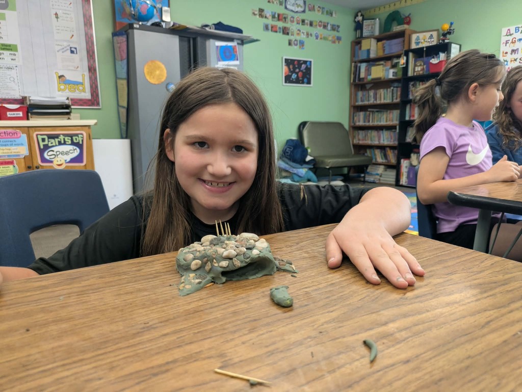 a girl with her stone fish