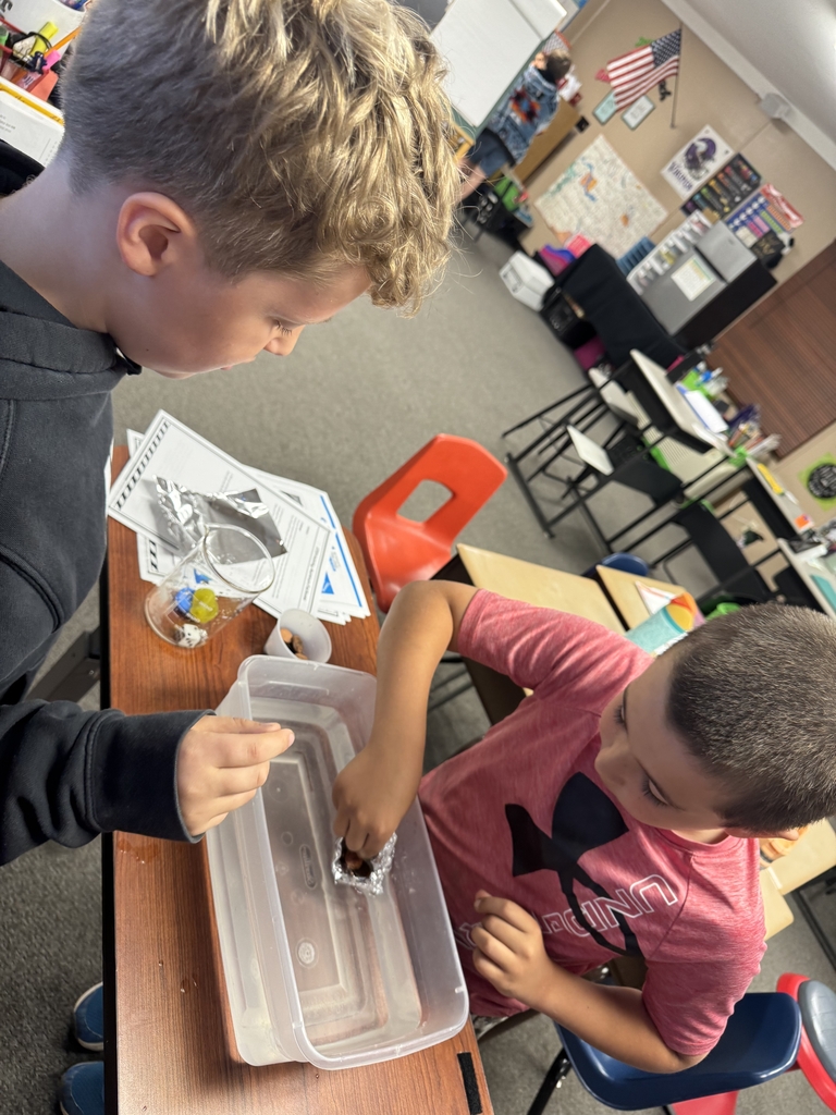 2 boys building a boat.