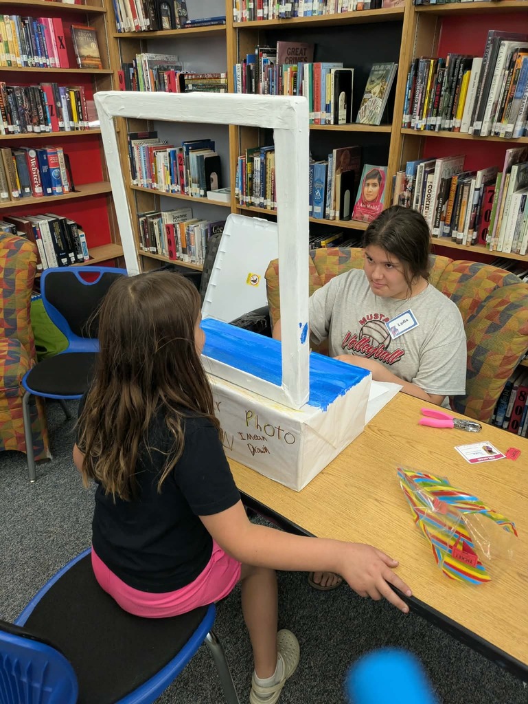a kid running a photo booth