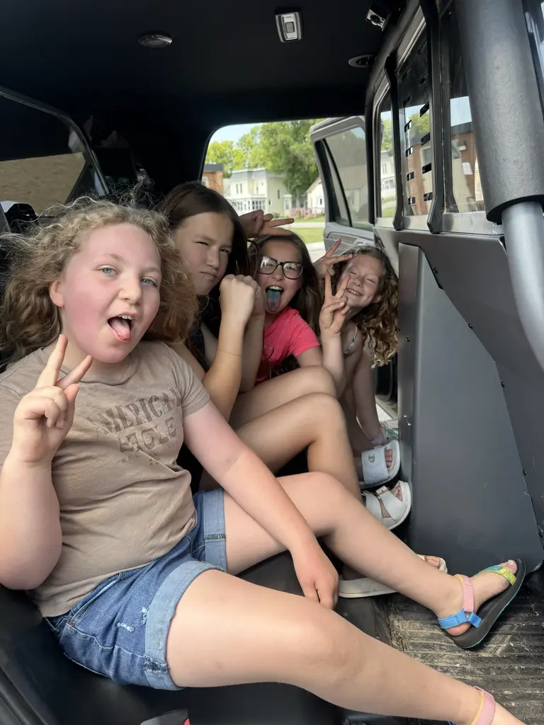 kids in the cop car