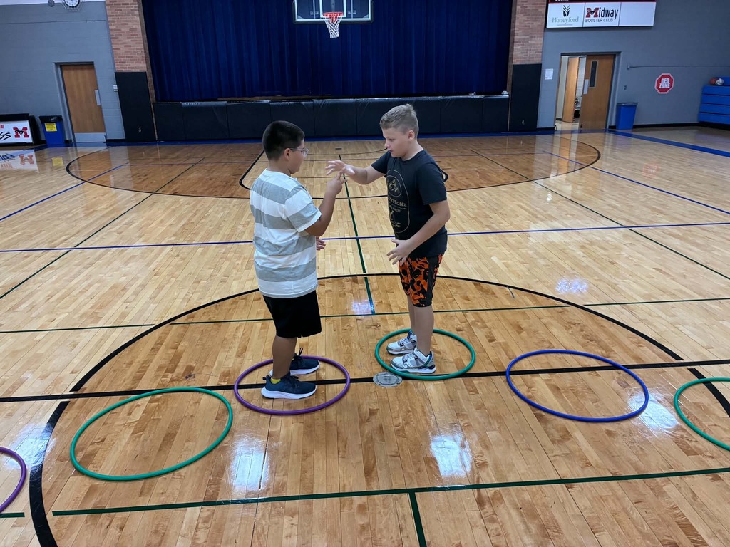 2 boys playing rock, paper, scissors