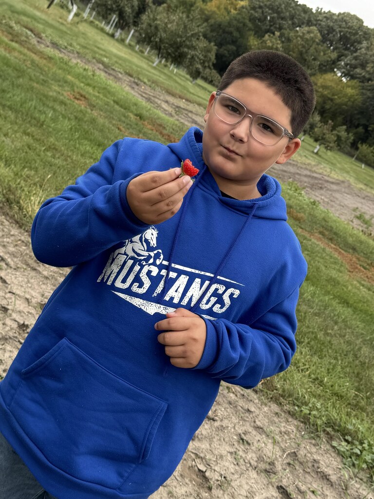 a boy and a strawberry