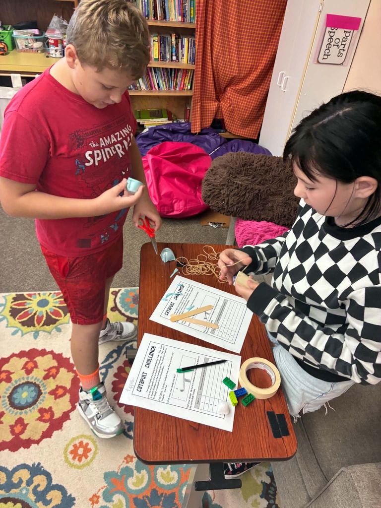 2 kids figuring out a machine