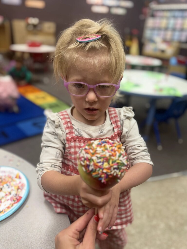 a girl and her caramel apple