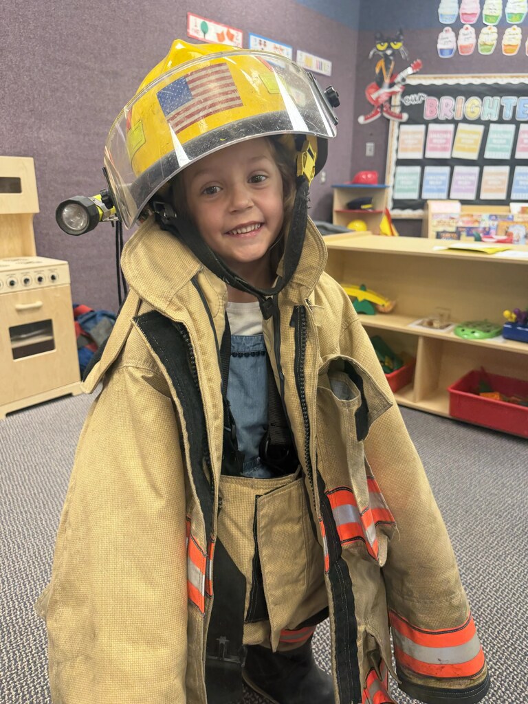 a girl with a fire jacket on