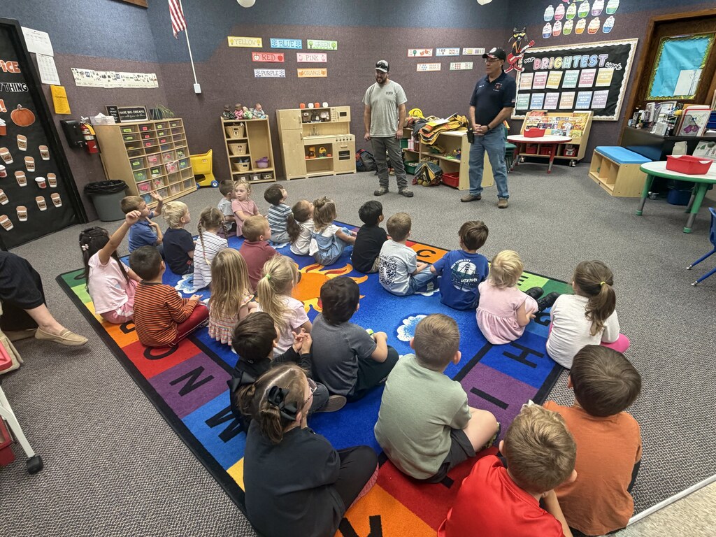 kids listening to the firefighters