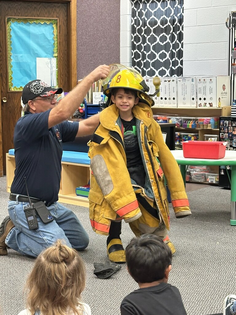 a boy getting the uniform on