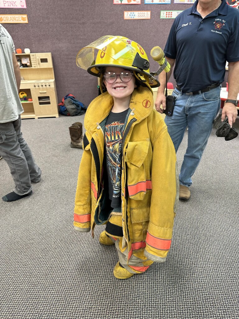 a girl in the fire fighter gear