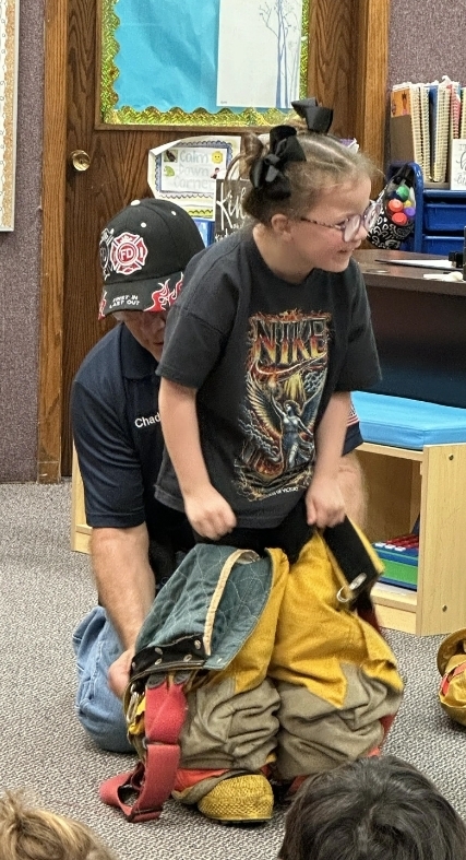 a kids getting the gear on