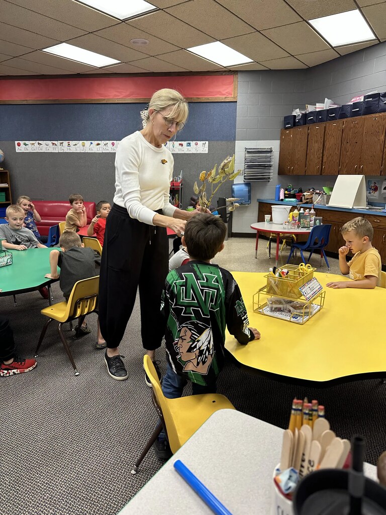 mrs Branvold helping kids