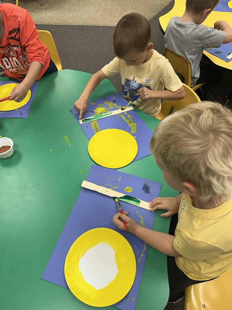 kids painting sticks