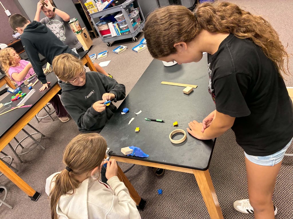 kids working together to create a machine