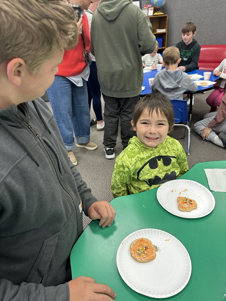 a boy and his decorated cookie