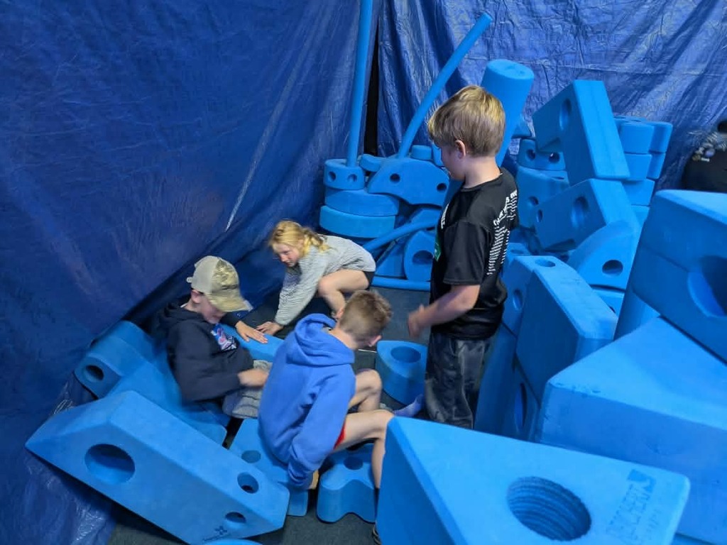 kids creating with foam blocks