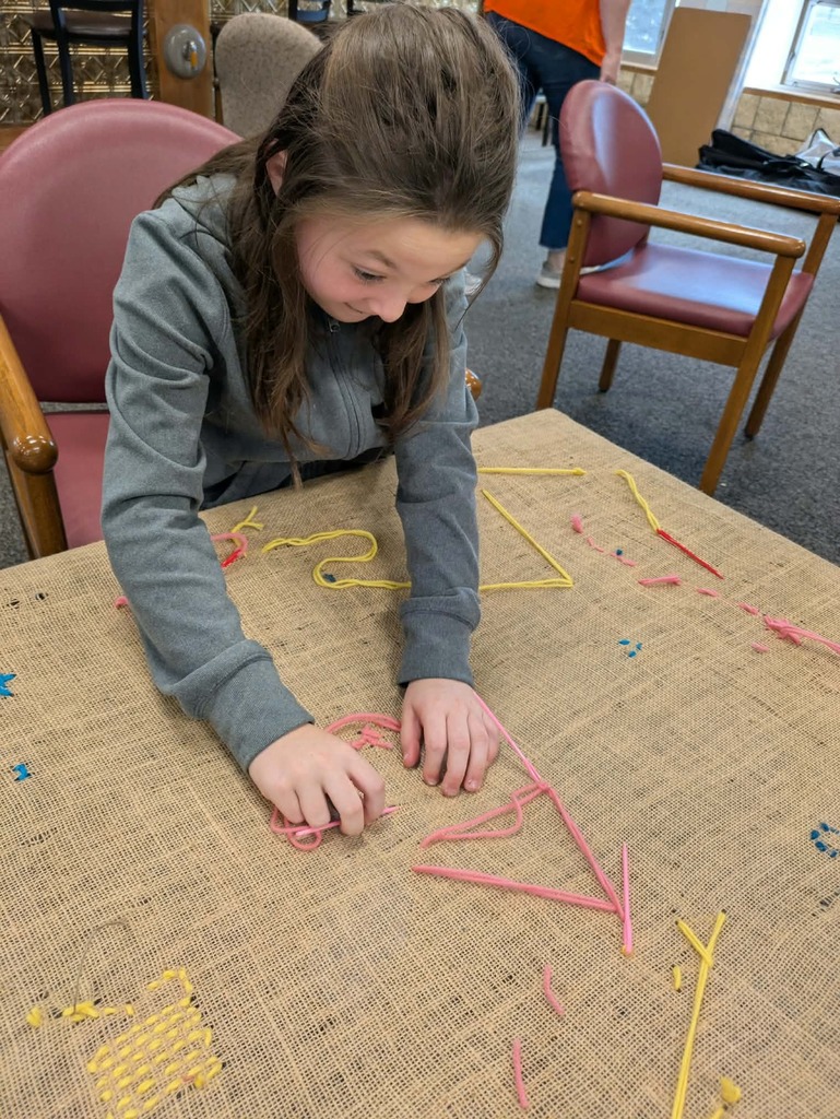a girl working with yarn