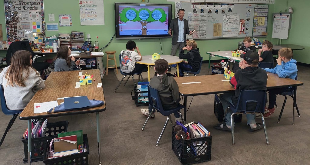 the senator presenting to the class