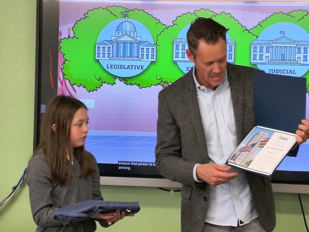 presenting an award to the class