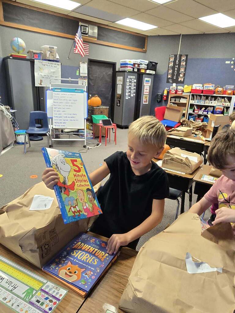 a boy opening a book