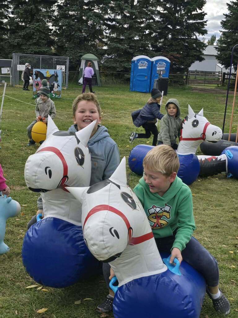 kids riding horses