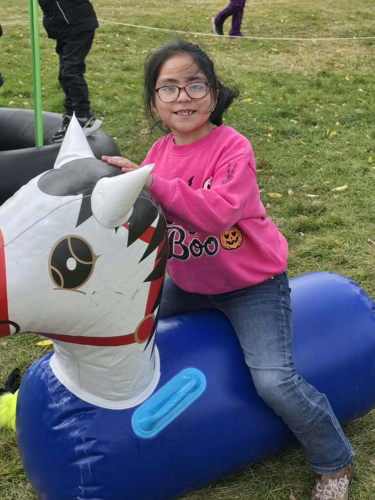 a girl bouncing on a horse