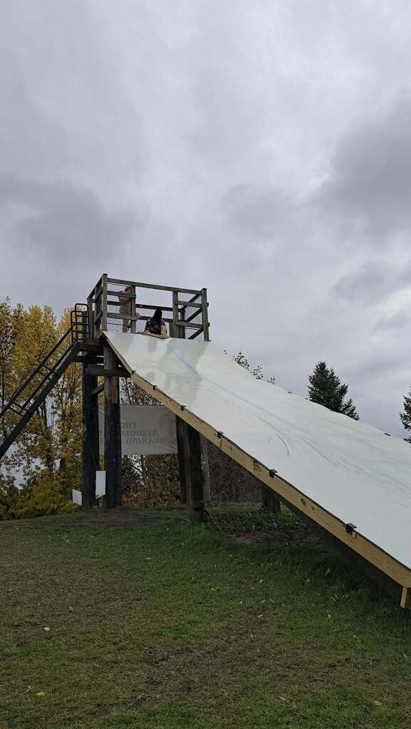 kids getting ready to go down the slide