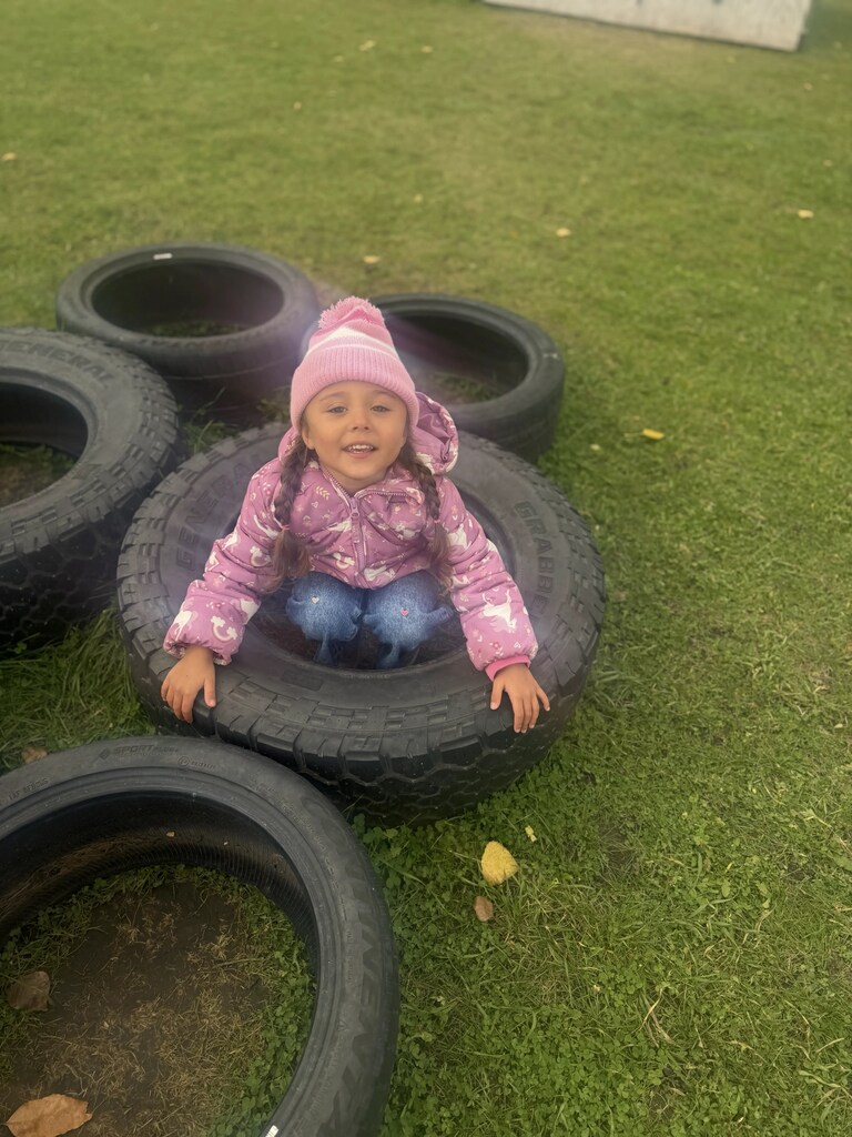 a girl in a tire