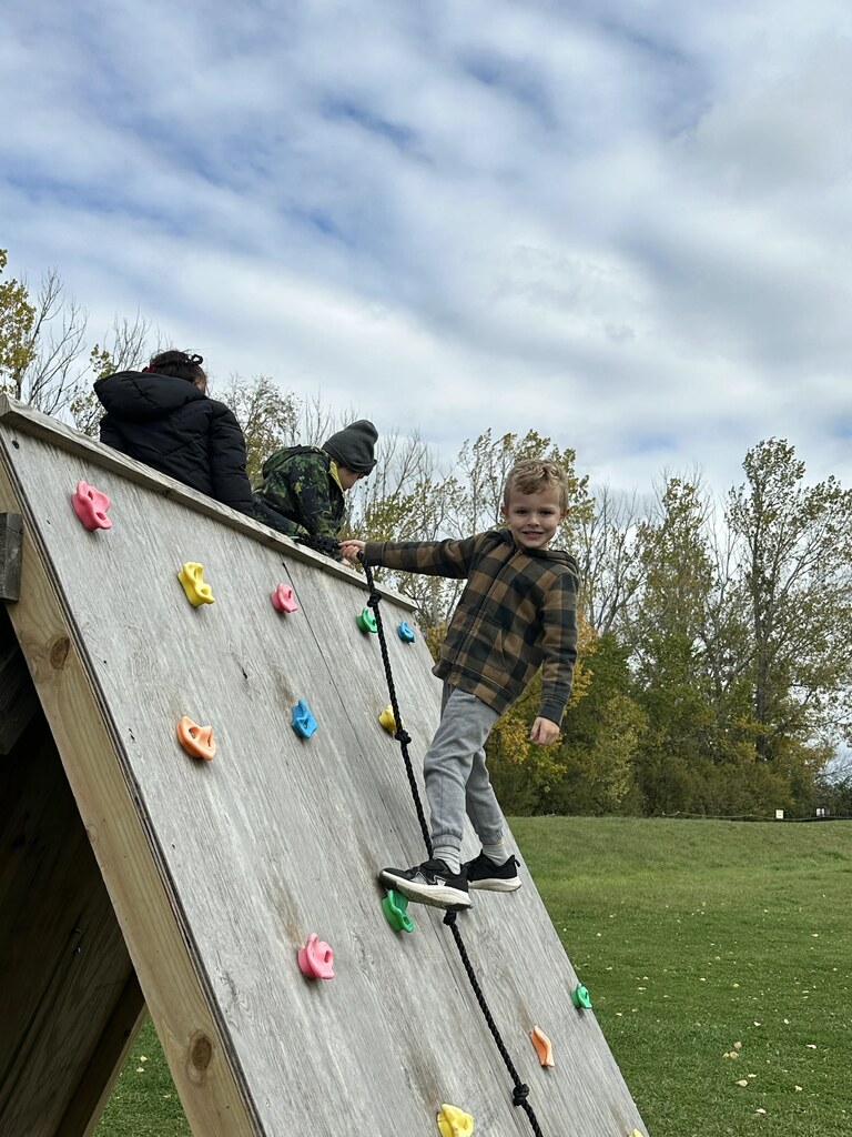 a boy climbing the wall