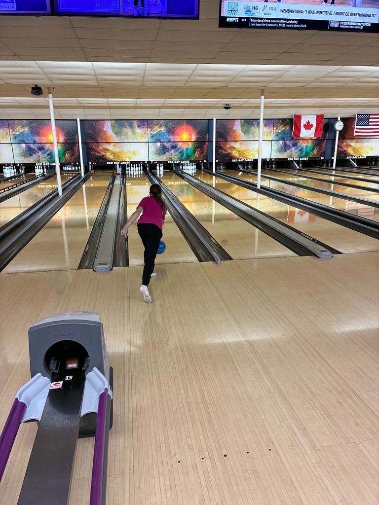 a kid bowling