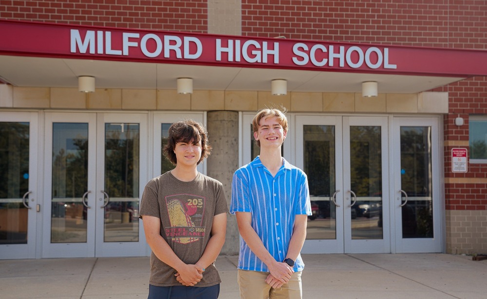 Milford High School seniors Jacob Peterson and Tyler Harpster stand outside the main entrance of Milford High School. Both students were named semifinalists in the 2027 National Merit Scholarship Program.