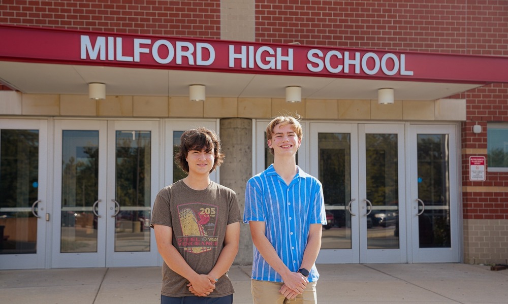 Milford High School seniors Jacob Peterson and Tyler Harpster stand outside the main entrance of Milford High School. Both students were named semifinalists in the 2027 National Merit Scholarship Program.