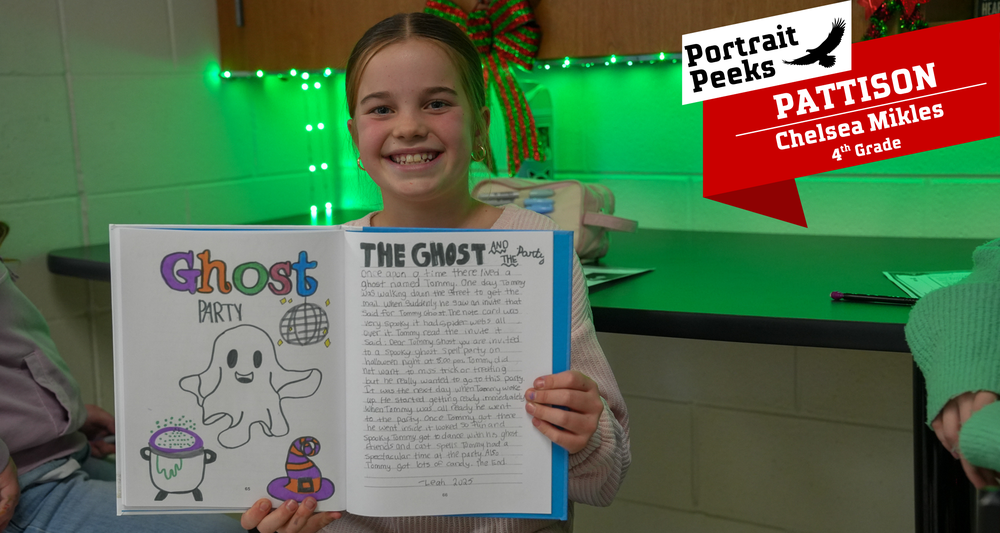 Girl holding up a book