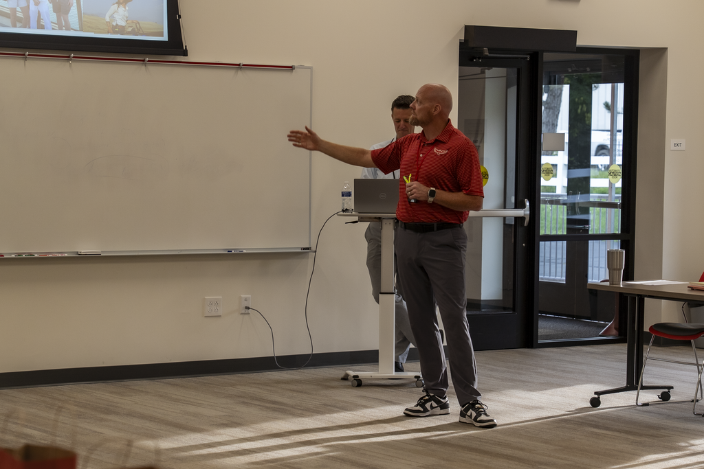 Superintendent Spieser pointing at slideshow