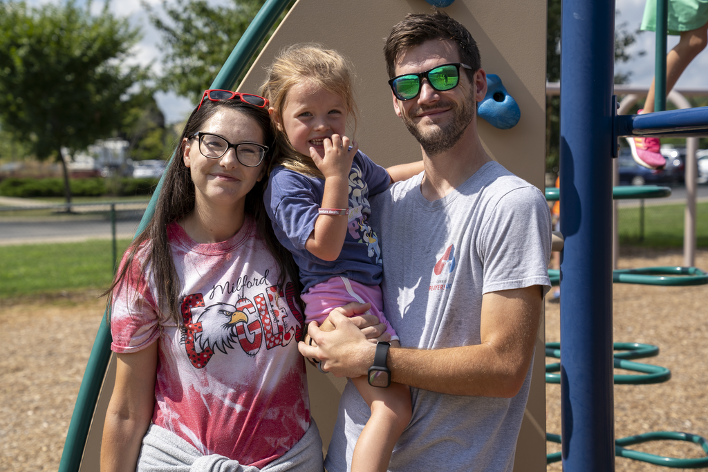 Family Smiling at Camera
