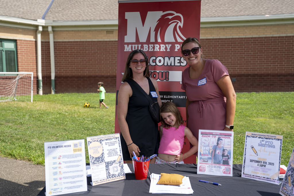 Mulberry PTO table with two women and a young girl
